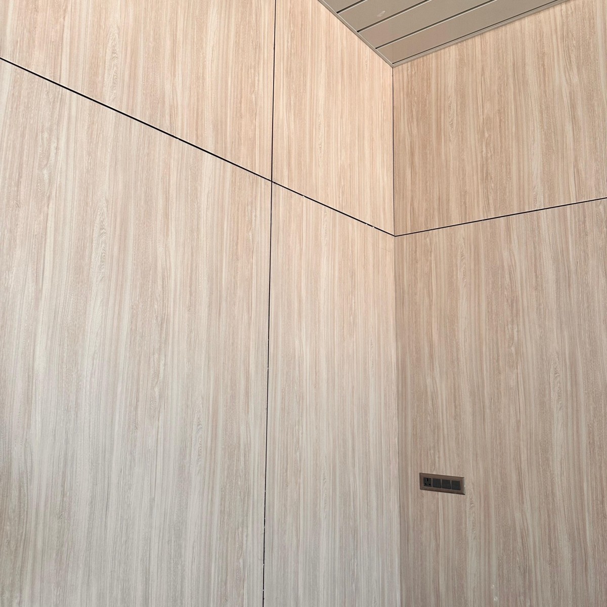 Interior HPL wall cladding on commercial building facade in Ahmedabad by Yashvi Infra Co
