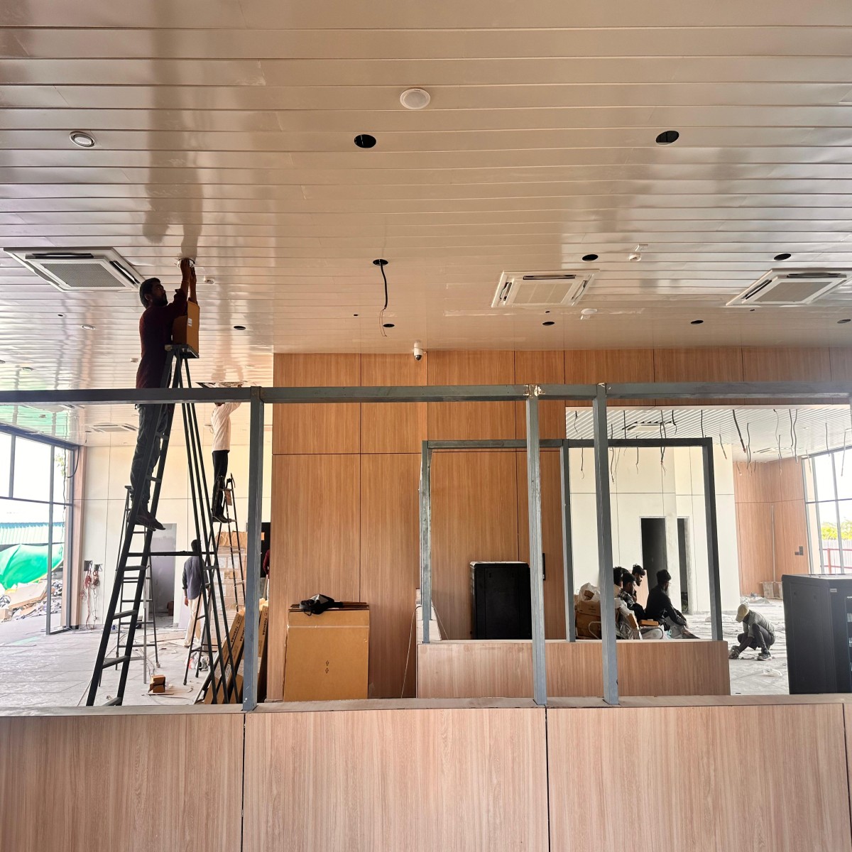 Completed HPL wall cladding installation on commercial building exterior by Yashvi Infra Co Gujarat