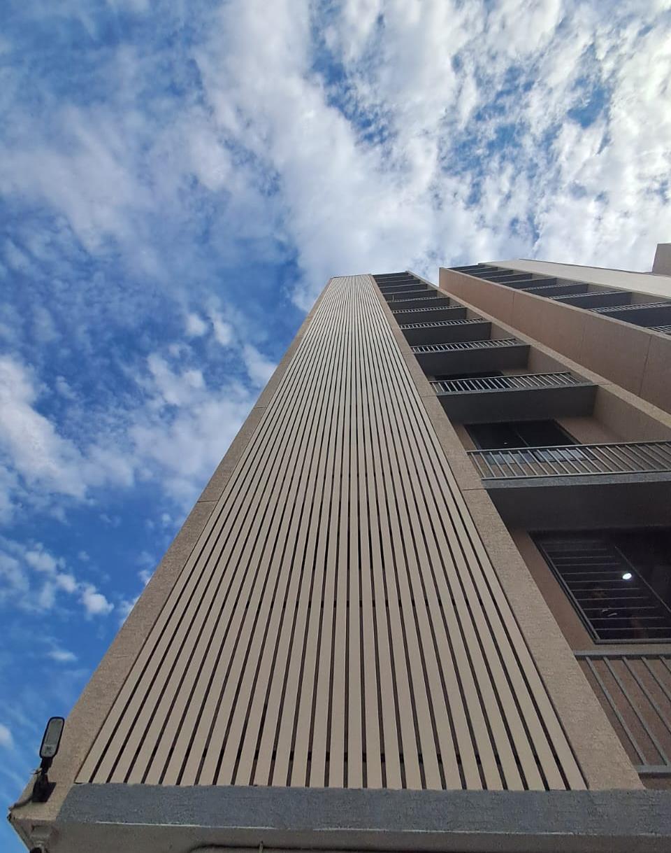 U-Shape P50 aluminium exterior louver on building facade Ahmedabad — Yashvi Infra Co Gujarat